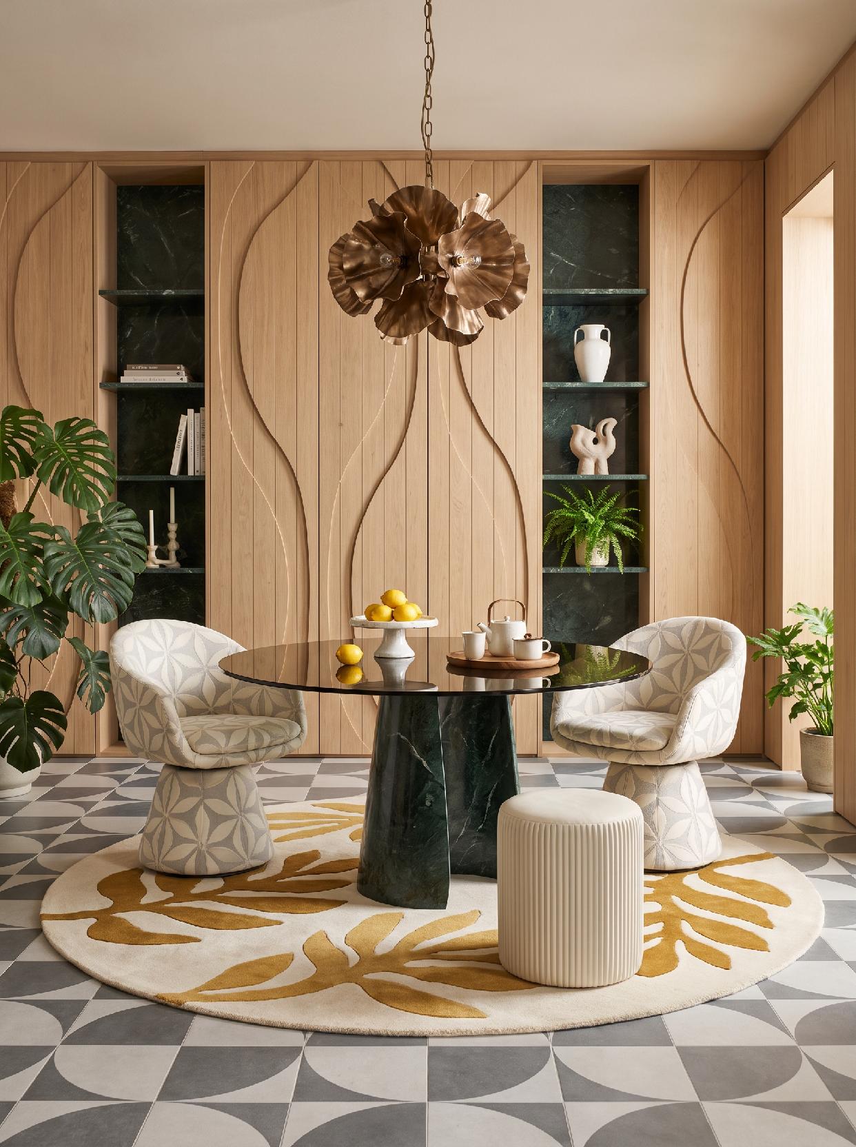 A photograph of a sophisticated and organically modern dining room with natural materials and sculptural eleme