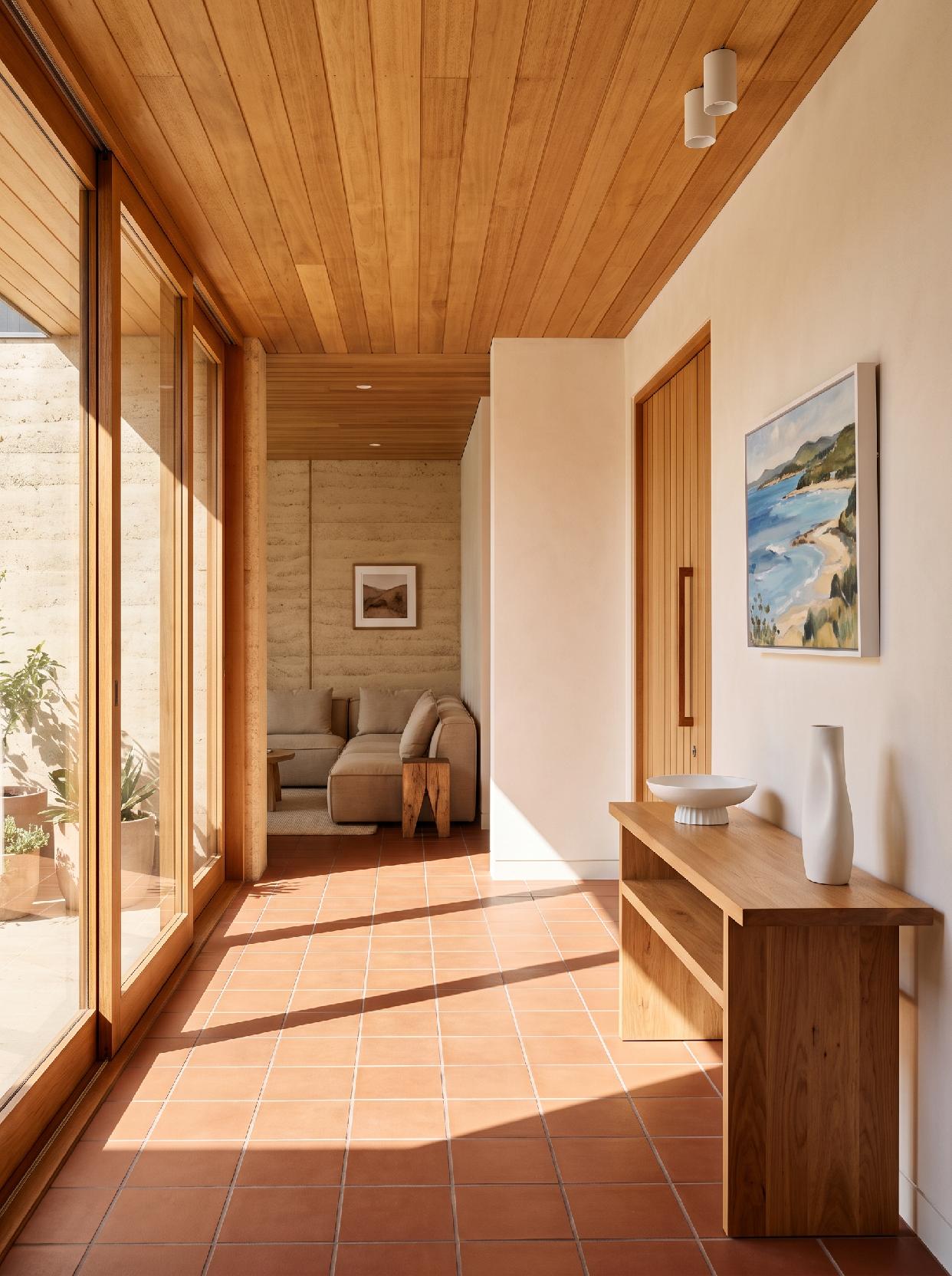 A photograph of a warm, minimalist entryway with natural materials and a serene, inviting atmosphere, captured