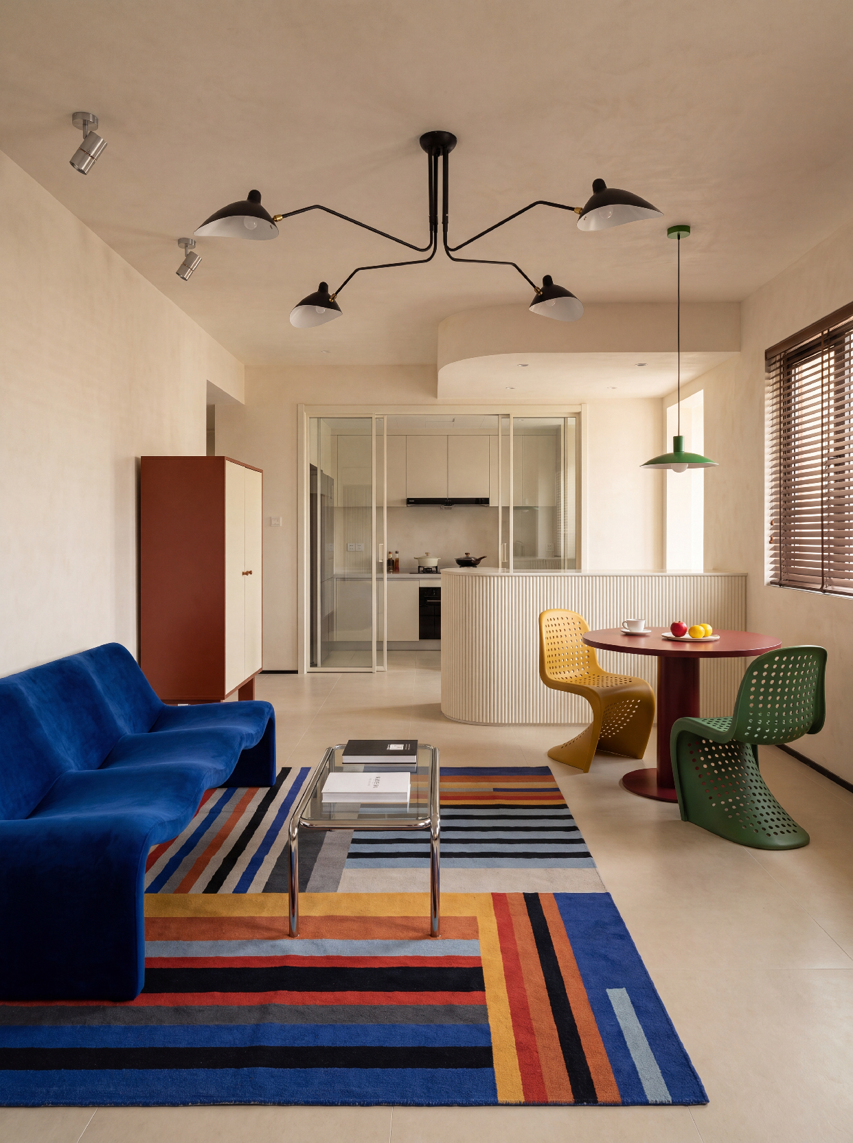 A photograph of a vibrant, retro-modern open-plan living and dining area with eclectic, playful design element