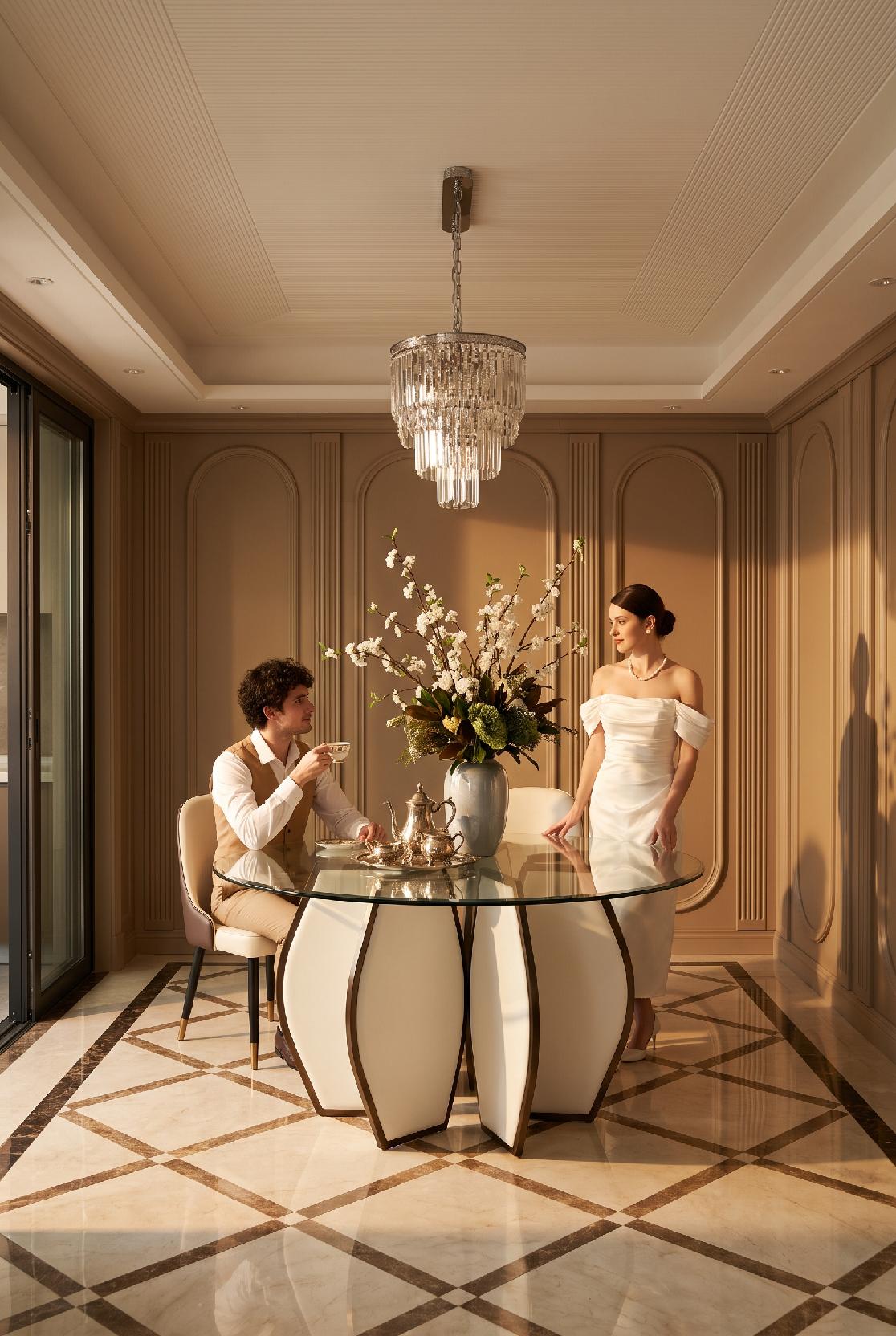 A photograph of a formal and elegant dining room with classical and contemporary influences, bathed in warm go