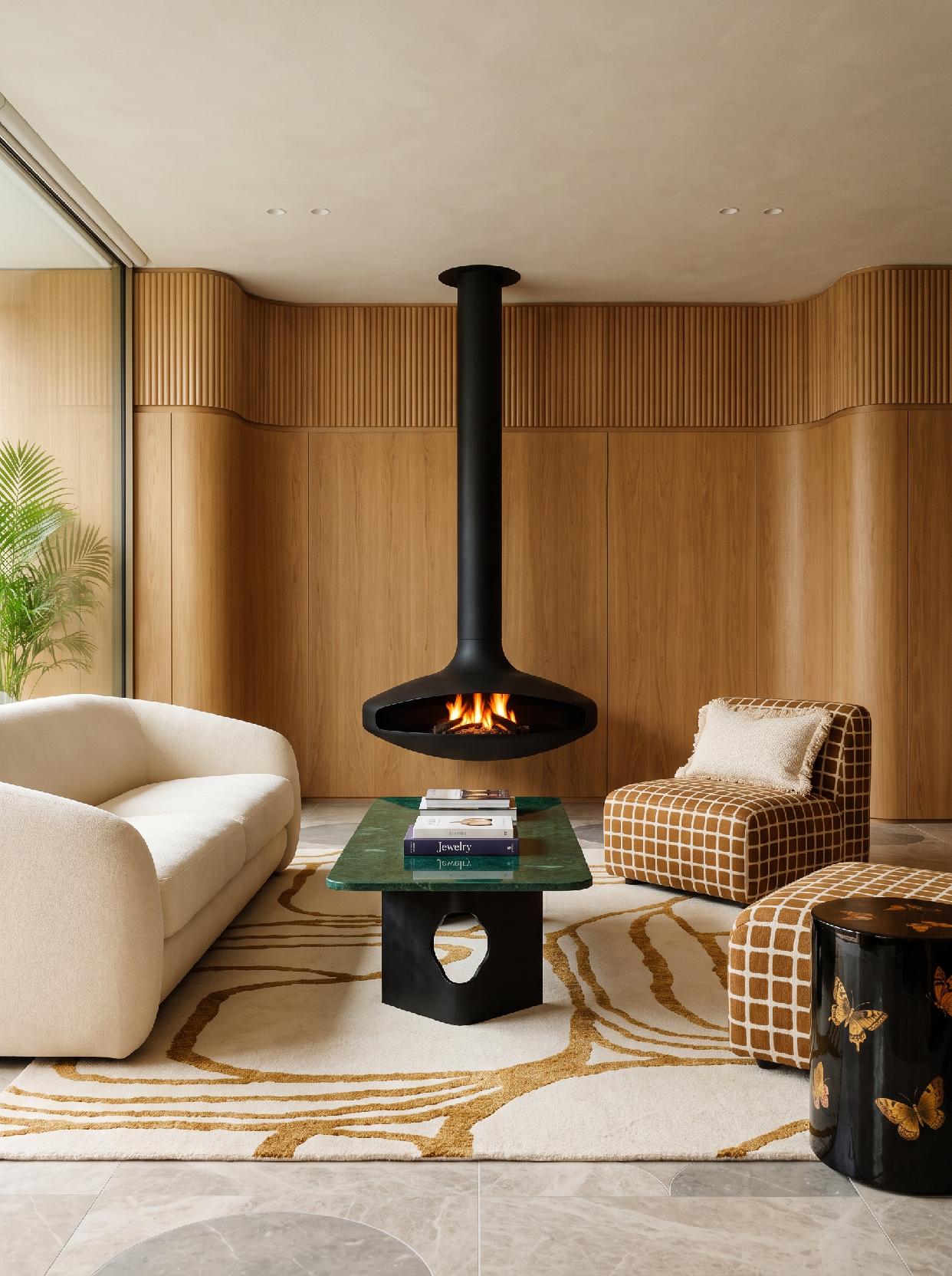 A photograph of a sophisticated and organically modern dining room with natural materials and sculptural eleme